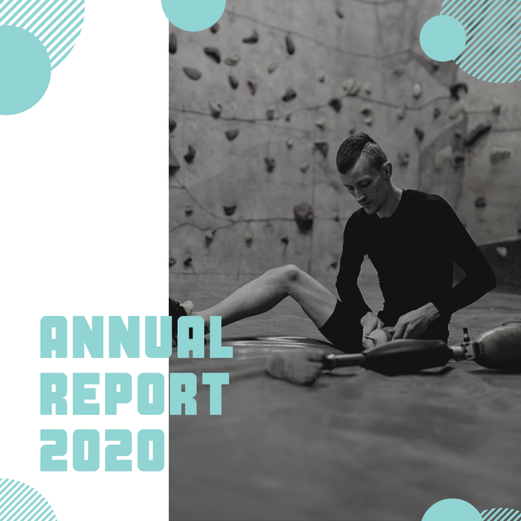 Image: a tall skinny man with a mohawk in a rock climbing gym. He is putting on a prosthetic leg. Text: Annual Report 2020