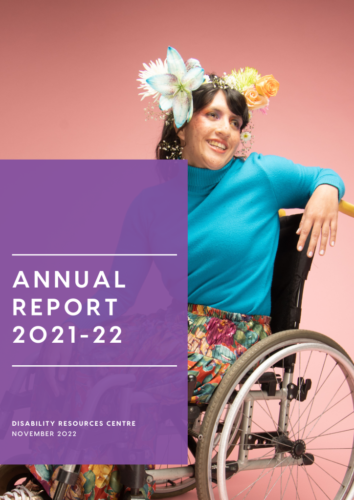 PDF of the DRC Annual Report for 2021-2023. The cover features a woman with fair skin and long brown hair using a manual wheelchair. She is wearing large flowers in her hair and smiling as she leans casually over the back of the chair.